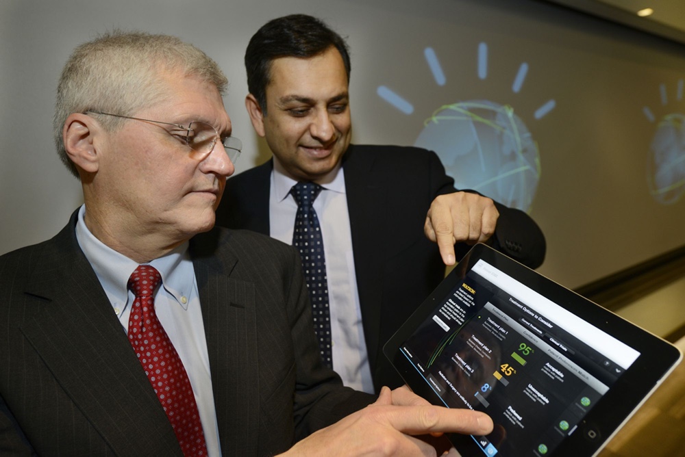 Mark Chris, M.D., Head of Thoracic Oncology, Sloan-Kettering Cancer Memorial Center, left, and Manoah Saxena, General Manager of IBM, Watson Solutions work with the first IBM Watson-based oncology solution in New York on February 11, 2013